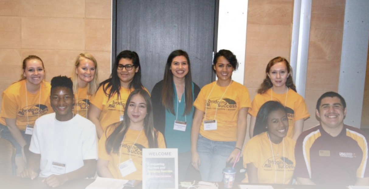People in Bridging Success shirts